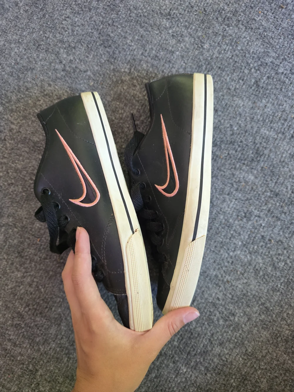 Nike Women's Black Sneakers with Pink Logo Accents